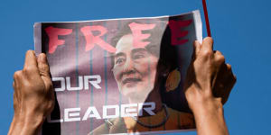 A demonstrator holds up a placard outside the Central Bank of Myanmar to protest against the military coup and to demand the release of elected leader Aung San Suu Kyi,in Yangon.