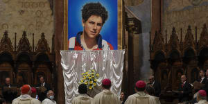 An image of Carlo Acutis is unveiled during his beatification ceremony celebrated by Cardinal Agostino Vallini in the St Francis Basilica,in Assisi,Italy,in 2020.