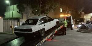 A Holden VN Commodore being impounded by police on the weekend. 