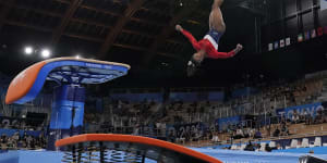 Simone Biles,of the United States,performs on the vault before her withdrawal in Tokyo.