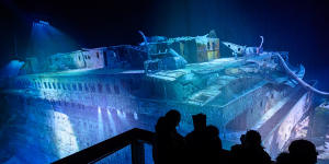 People look at a large-scale 360 degree panorama presentation of the Titanic shipwreck by artist Yadegar Asisi.