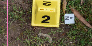 A police crime scene photograph of a lead fragment at Bucks Camp.