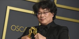 Bong Joon-Ho with the awards for best director and best international feature film for Parasite at the Oscars.