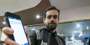 Square founder Jack Dorsey demonstrates the company's reader,which is set to get a final tick of approval from global credit card companies. 