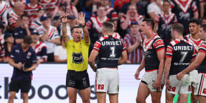 Referee Gerard Sutton sends Roosters centre Joey Manu to the sin-bin in round three.
