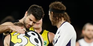 Noah Cumberland is consoled by former Richmond captain Trent Cotchin.