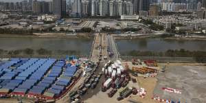 A construction site for coronavirus isolation facilities and a temporary bridge linked China’s Shenzhen and Hong Kong’s Lok Ma Chau cities in Hong Kong,