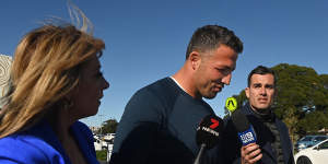 Souths legend Sam Burgess leaves club headquarters after a board meeting last August.