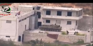 Footage supplied by the Free Syrian Army's Fursan al-Haq Brigade shows a Syrian tank near Ariha,in Syria's Idlib province,moments before a TOW missile strike.