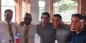 Cricket South Africa officials Clive Eksteen and Altaaf Kazi pose with spectators wearing Sonny Bill Williams masks at St George’s Park in 2018.
