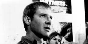 Harrison Ford in Sydney in 1985 to promote Witness,with director Peter Weir in the background. 