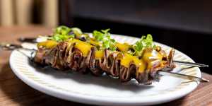 Ox-tongue skewers with mustard dressing.