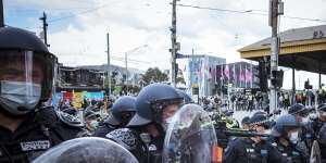 Police face protesters in September