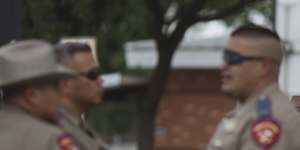 Texas state troopers outside Robb Elementary School in Uvalde.