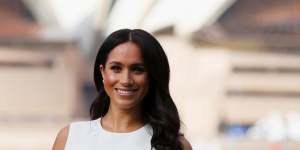 Meghan poses outside the Sydney Opera House during the royal tour. 