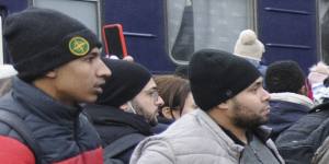 People gather to catch a train and leave Ukraine at the Lviv railway station.