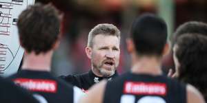 Nathan Buckley addresses a Collingwood huddle.