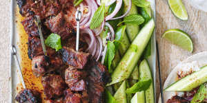 Coconut and lemongrass pork skewers with chilli-vinegar sauce.