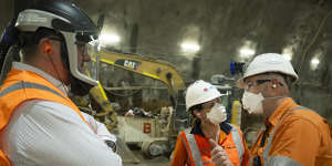 Project director Bob Nowotny,left,Sydney Metro head of project delivery Angela Jeffery and construction director Scott Connor in the Hunter Street station.