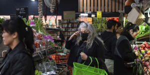 Shoppers browse the fruit and vegetable stalls at South Melbourne market earlier this month.