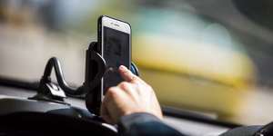 There are perfectly legal reasons to use phones while driving,as long as they are in cradles. 