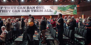 National Rifle Association members applaud during their annual meeting,held in Nashville in April.