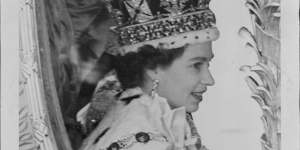 A close-up of the newly-crowned Queen,wearing the Imperial State Crown during her processional drive after her Coronation.