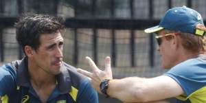 Andrew McDonald chats with Mitchell Starc during training for the Boxing Day Test in 2019.