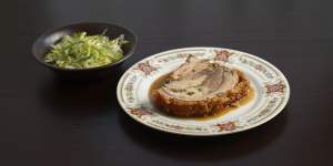 Amber Creek porchetta served with jus and a side salad.
