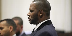 R. Kelly stands during a hearing in his sex abuse case at Leighton Criminal Court Building in 2019.