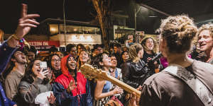 Crowds inundated the streets of Byron Bay after Splendour in the Grass cancelled its first day due to bad weather. People waited in long queues to enter venues. Local band The Seeding played for eight hours to keep the swelling crowd amused.