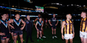 Power coach Ken Hinkley interacts with Hawks skipper James Sicily (right) in a dramatic conclusion to the sides’ semi-final.