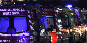 More than 30 ambulances wait to hand over COVID-19 patients to medics at the Santa Maria hospital in Lisbon in January.
