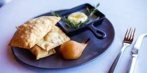Holy Goat La Luna cheese,rosemary and cumin bread crisps and hay-baked pear at Paringa Estate.