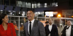 $3.6 million smile:Folau leaves last week's hearing with wife Maria after agreeing a deal with Rugby Australia.
