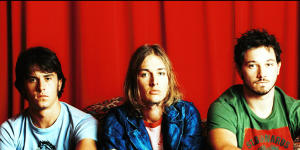 In happier times:Daniel Johns (centre) with Silverchair bandmates Ben Gillies and Chris Joannou in 2002.