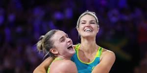 Australian netballers Gretel Bueta and Liz Watson celebrate gold in the final at Birmingham.
