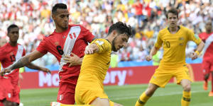 Socceroos Matt Leckie fends of Miguel Trauco of Peru in the 2018 World Cup