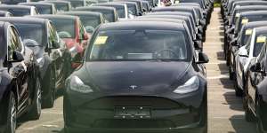 Tesla vehicles wait for shipping in Shanghai. Tesla predicts record-breaking production despite pandemic disruptions.