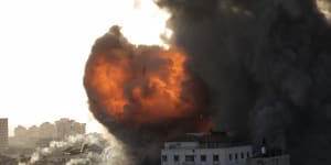 Smoke and fire rises following Israeli airstrikes on a building in Gaza City on Wednesday.