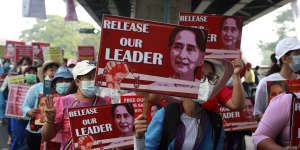 University teachers march with the images of deposed Myanmar leader Aung San Suu Kyi in Yangon,Myanmar,Friday,Feb. 26,2021. 