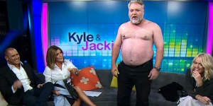 Kyle Sandilands takes his top off on Channel 7's The Morning Show alongside Larry Emdur (left),Kylie Gillies and Jackie'O'Henderson in 2015.