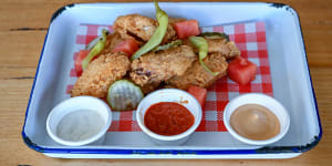 Fried chicken wings with pressed watermelon,chipotle aioli,pickles and tahini yoghurt.