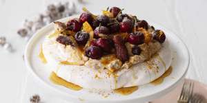 Adam Liaw's Christmas pudding inspired pavlova with spiced brandy-spiked cream.