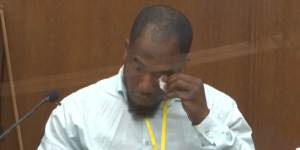 Donald Williams wipes his eyes as he answers questions during the trial of Derek Chauvin.