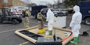 Ohio National Guard Civil Support Team members prepare to enter an incident area in East Palestine,Ohio,to assess remaining hazards with a lightweight inflatable decontamination system.