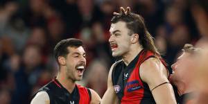 Essendon cult figure Sam Draper celebrates a goal.