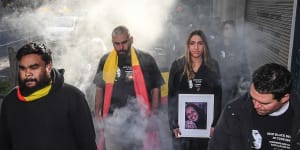 Tanya Day's family and supporters take part in a smoking ceremony ahead of the 2019 inquest into her death.