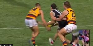 Adelaide’s David Mackay and St Kilda’s Hunter Clark simultaneously lunge for the ball. Clark ended up with a broken jaw.