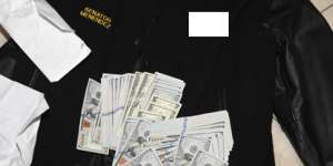 A jacket bearing Menendez’s name,along with cash from envelops found inside the jacket.